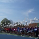 Players release white balloons